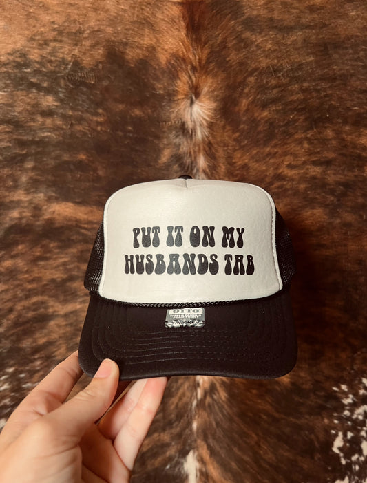 Put it on my Husbands Tab Trucker Hat